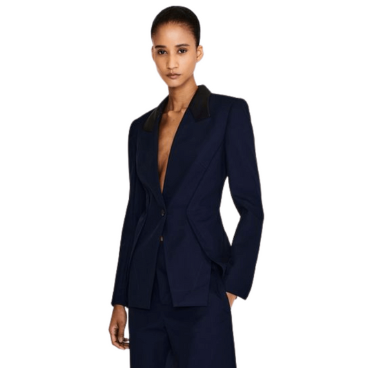 Woman wearing a navy blue suit on a white background