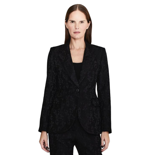 Woman wearing a black suit on a white background